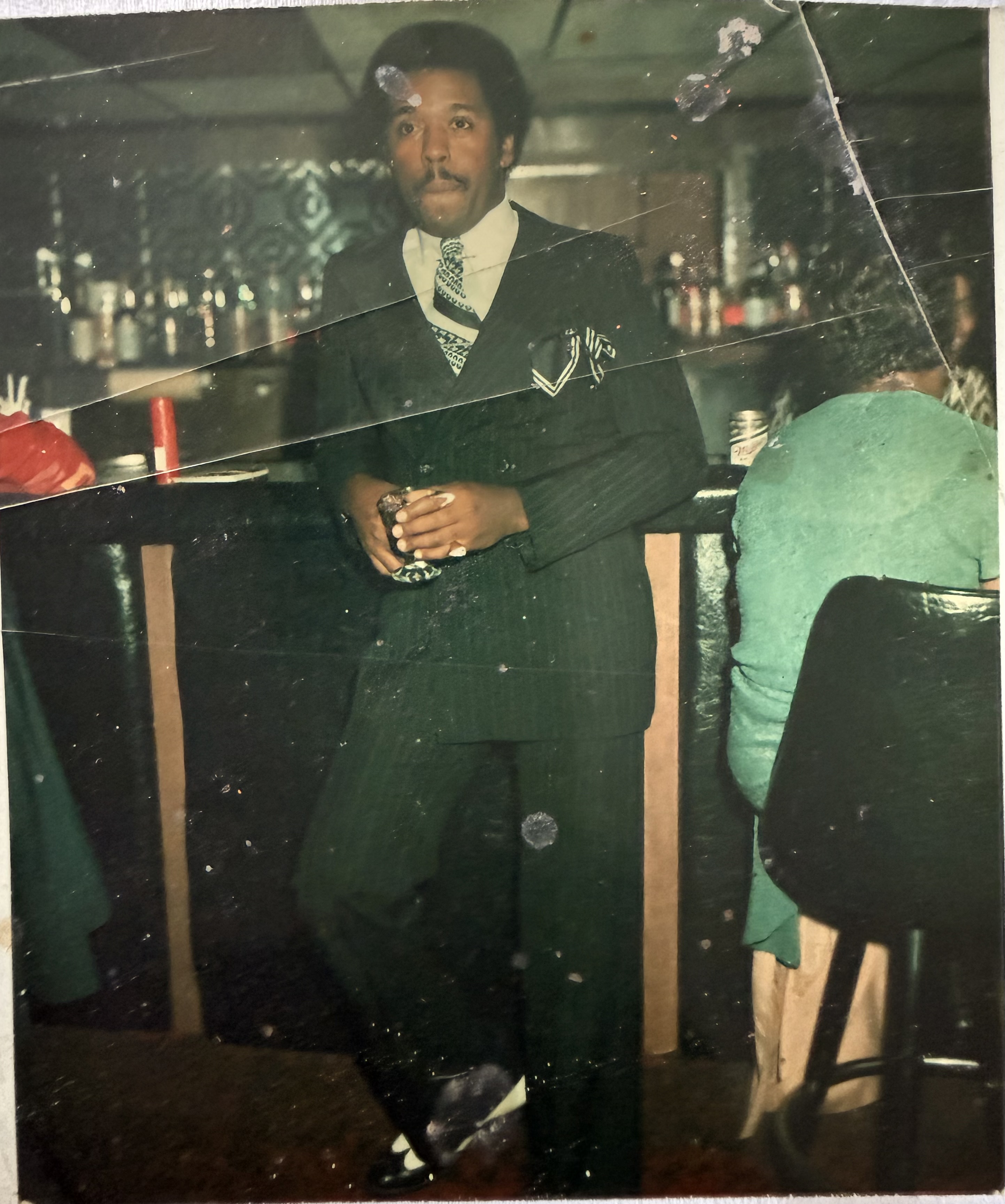 Raymond dressed in a formal suit